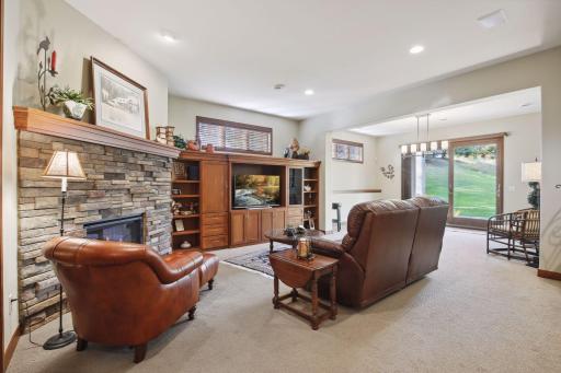 Surround yourself in comfort in front of the Family Room's stone fireplace.