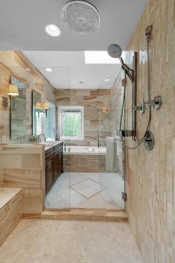 Spectacular walk through glass encased shower with dual rain heads