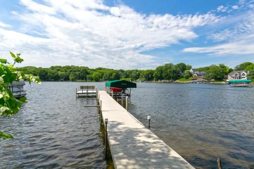 The boat dock, lift & canopy are included & the oversized 4-car garage provides plenty of space for all land/water toys.