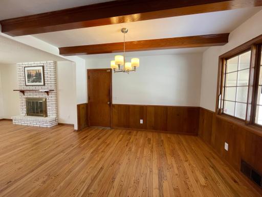 Beautifully refinished hardwood floors in dining and living room ! Dining room accented with wood beams.