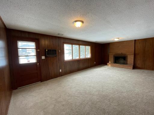 Spacious lower level family room with south facing windows walkout to back yard. Future buyer might want to add patio door for easy access to backyard.
