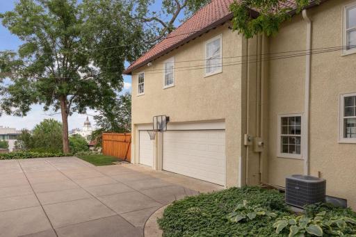 West side of home with three car garage, two addn. parking spaces, and full skyline views. Garage is insulated and heater was recently installed. Separately metered EV outlet for discounted electric rates.