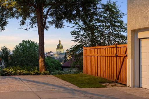 View from driveway with two additional parking spaces. There is a full skyline view from end of driveway.
