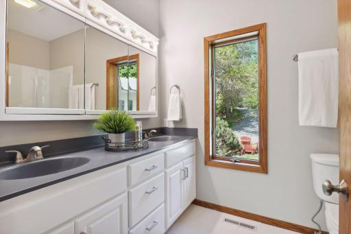 Primary Bath with Dual Vanity, Tile Floor, Enameled Cabinets, New Faucets & Hardware