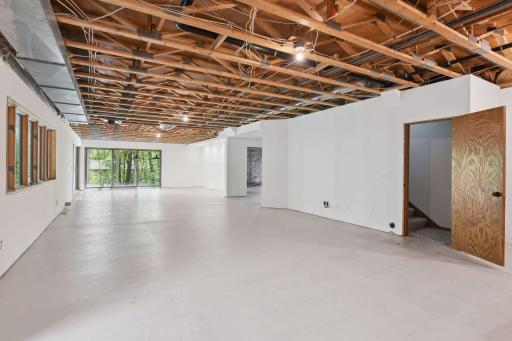 Wowsa - over 2400 unfinished square feet as your canvas - make it what you want. This part is already sheet rocked on walls with wonderful large windows