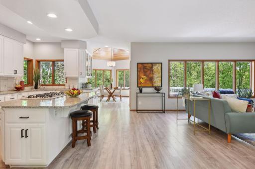 Space is versatile - could add Dining Table here for Living/Dining Combo and have Sun/Sitting Room/Office where current table is... whatever works best for your lifestyle and needs