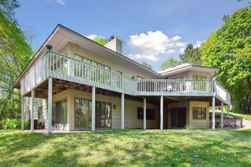 View of Deck wrapping around home and the lower level patio area