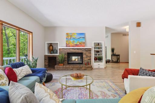 Wood Burning Brick Fireplace Highlights the Room