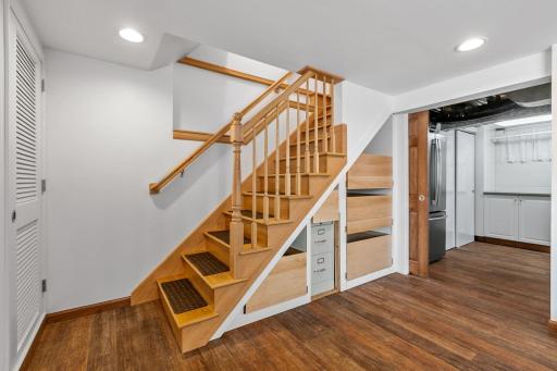Open rail staircase leads to lower finished level