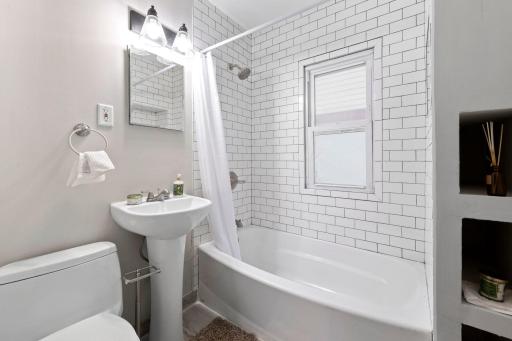 Bathroom was fully remodeled with wonderful tile work and niches along the back wall!
