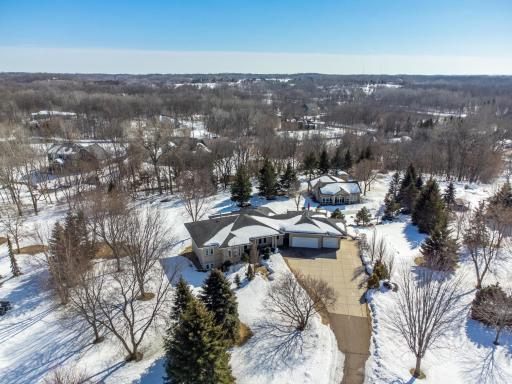 Stunning custom built rambler on an incredible 2.5 acres offering a beautiful sprawling backyard with in-ground pool, a fantastic custom pool house, outdoor kitchen, and more!
