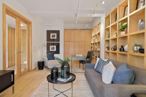 The main level den has been used as a library, media room, home office, and occasional third guest bedroom.