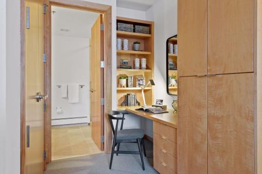 Second bedroom suite closet, built-in storage, desk area, and 3/4 bath.