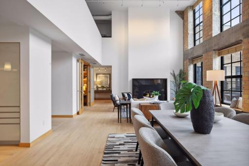 A hallway off the main living area leads to a discreet powder room and the primary bedroom suite.