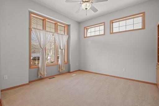 Formal living room or dining room. The beautiful additional windows fill the home with natural sunlight!