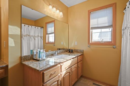 Private bathroom with granite vanity top, shower, and separate make up station!