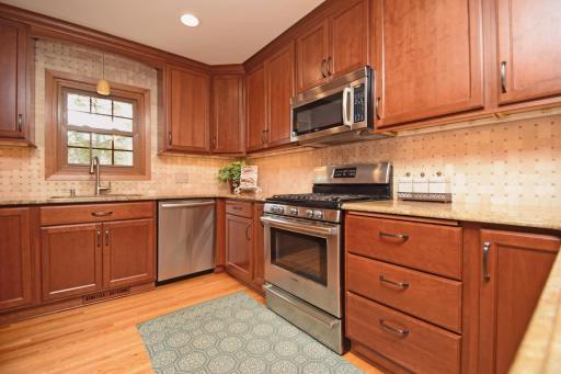 Quality stainless appliances, plentiful storage and loads of granite countertops make this a wonderful kitchen for cooking, baking and entertaining. And it's easy to keep an eye on the back yard with the handy kitchen window.