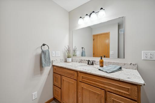 A three-quarter bathroom serves the lower-level bedrooms and family room.