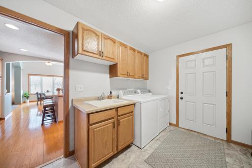 Rounding out the main level is this convenient laundry, complete with a large soaking sink.