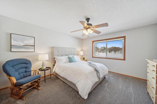 The spacious primary bedroom suite features a walk-in closet and private full bath.