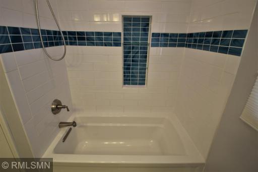 Full Bath soaking tub with custom tile surround & recessed shelf.jpg