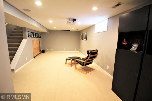 Large Family Room with Big Screen Wall, Projector, Media Center and Surround Sound.jpg