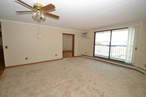 New Carpet Thoughout with Spacious West Facing Living Room Leads to Private Balcony