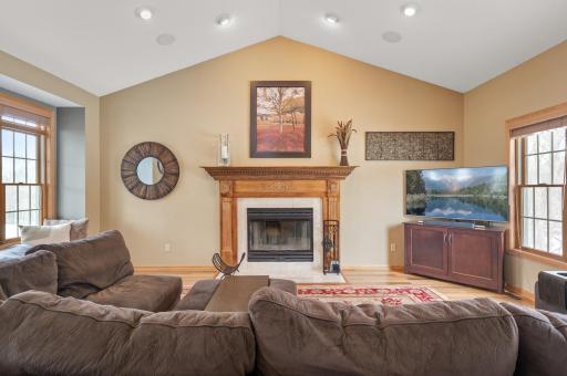 Impressive Great Room with vaulted ceilings, Brazilian walnut hardwoods, cozy gas fireplace and plenty of natural light!