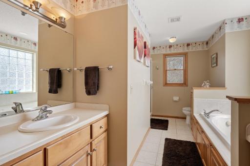 Spacious Owners Bath with convenient split vanities, jetted tub and separate shower.