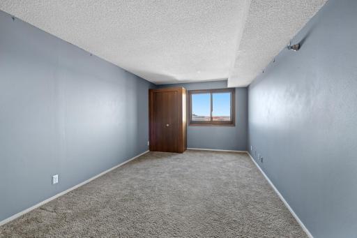 This spacious bedroom can easily accomodate a king size bed and oversized furniture.