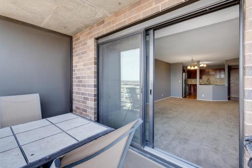 The oversized patio door has been updated for easy access to the balcony.