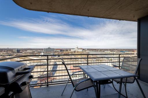 Gas grills are allowed on balconies. This home comes with a small bistro table, two chairs and a newer CharBroil gas grill.