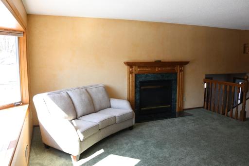 Gas fireplace in living room, couch can stay if you want.