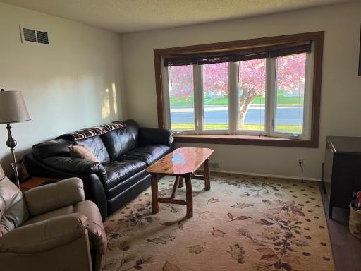 Large window in the living room provides so much natural light.