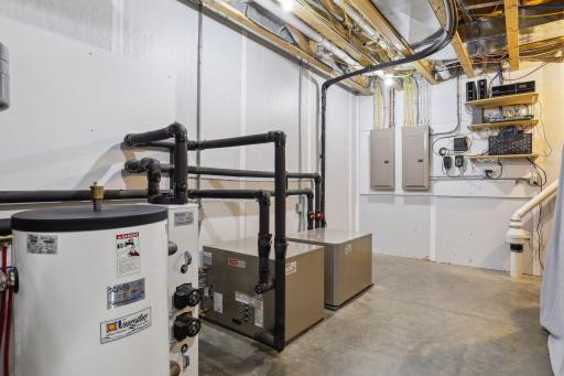 Utility room with geothermal heat pump system