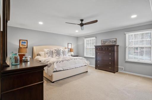 Owners suite with recessed lighting, crown molding, full bathroom and custom closets.