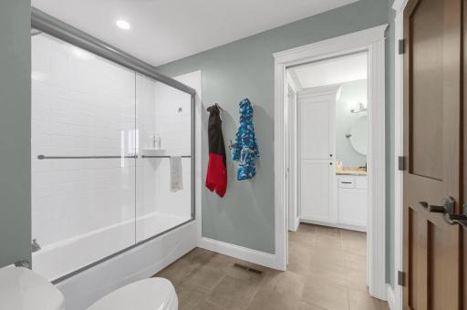 Jack and Jill bathroom between bedrooms 3 and 4 with an extra large linen closet