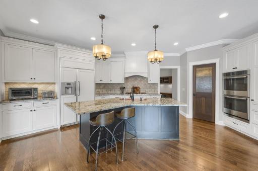 Don't miss the walk-in pantry with built-in shelving