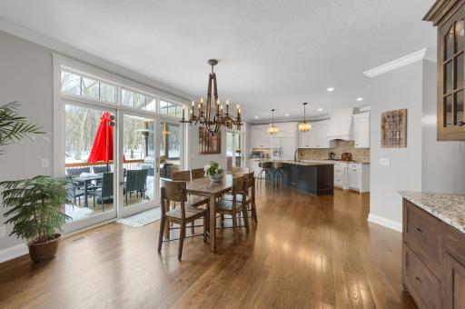 Two sliding glass patio doors leading to the deck and screened porch