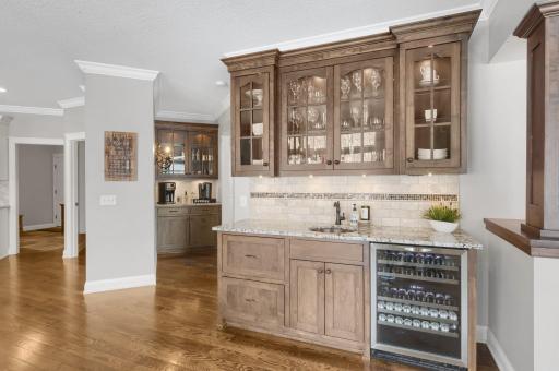 Wet bar with beverage cooler, copper sink, and plenty of storage