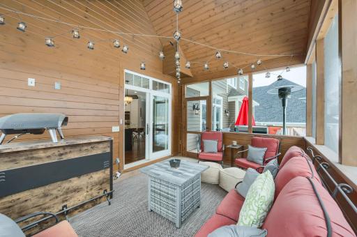 Screened porch off the kitchen leads to deck