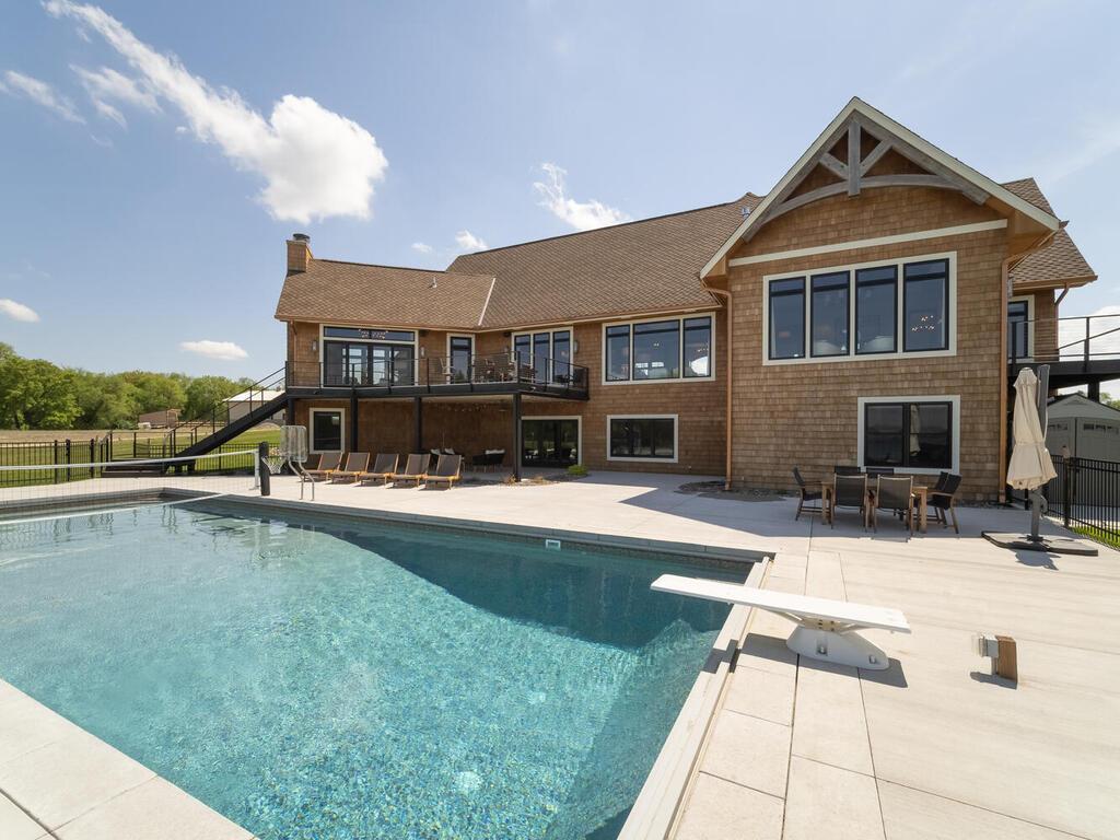 Enjoy endless summer days lounging by the pool.