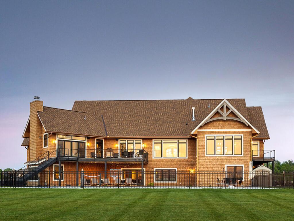 Cedar shark siding surrounds the home.