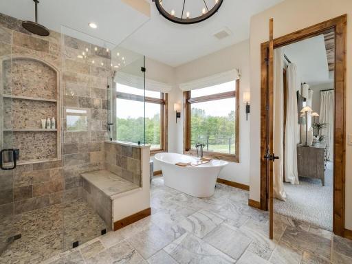 Huge master bath with dual sinks and separate stool room.
