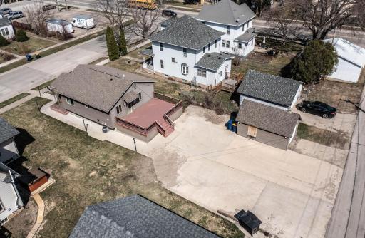 Aerial of the back of the property. Check out the parking pad and concrete patio!!!