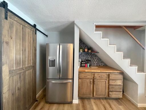 Extra fridge and coffee bar under the stairway