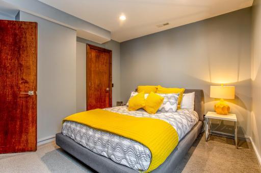 Main-floor Guest Room with south-facing window with lake views, plus a spacious walk-in closet.
