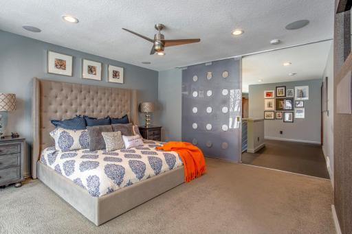 Spectacular Master Suite featuring wall-to-wall, floor-to-ceiling Anderson windows with a sliding door that opens 8', plus remote controlled disappearing blackout blinds!