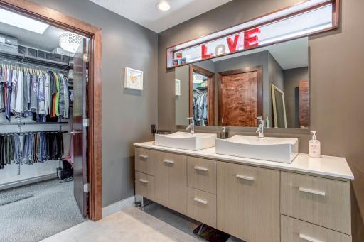 Custom walk-in closet with skylight that features a remote that can open/close it, a rain sensor, shades, and more!