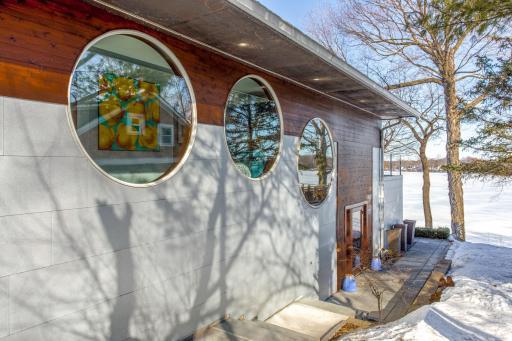 Natural light floods the home throughout the day with 6’ & 7’ tall circular windows on the East.
